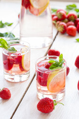 fresh lemonade with strawberries , lemon and mint