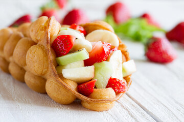 waffles with fruits, strawberries, apple and kiwi