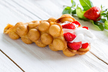 Hong Kong waffles with strawberries and whipped cream