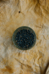 Winter Berries Stored in a Glass Jar on a Textured Background