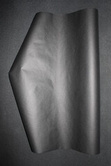 Gray, smoky shiny craft paper on dark background 