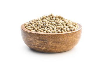 Whole pepper spice. White peppercorn grain in wooden bowl.