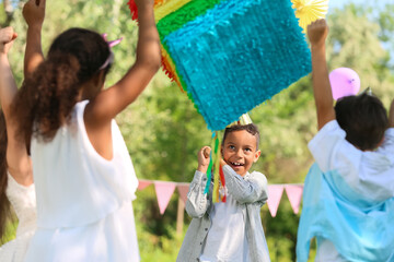Cute children at pinata birthday party