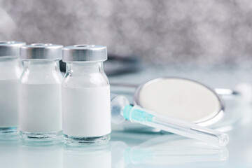 Vaccine bottle with blank white label.Vaccination, immunization, treatment to provides active acquired immunity to a particular infectious disease. Healthcare And Medical concept.