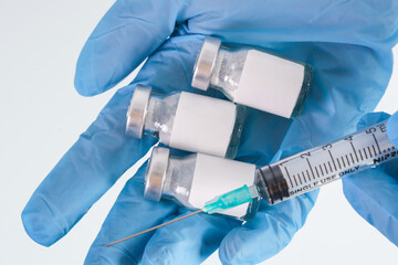 Scientist or medical worker holds vaccine bottle.Vaccination, immunization, treatment to provides active acquired immunity to a particular infectious disease. Healthcare And Medical concept.