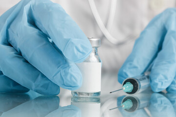 Scientist or medical worker holds vaccine bottle.Vaccination, immunization, treatment to provides active acquired immunity to a particular infectious disease. Healthcare And Medical concept.