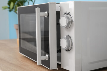 Modern microwave oven in kitchen, closeup