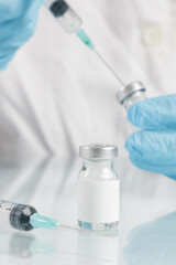 Scientist or medical worker holds vaccine bottle.Vaccination, immunization, treatment to provides active acquired immunity to a particular infectious disease. Healthcare And Medical concept.