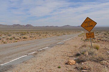 Flood sign on old desert road, Providence Mountains, Mojave Desert, California, USA