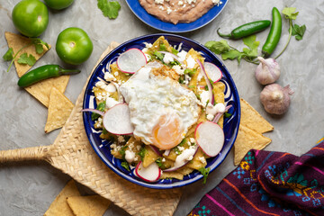 Mexican green chilaquiles with fried egg and cheese