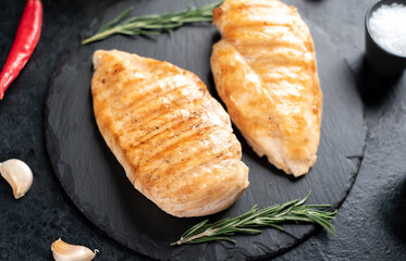 grilled chicken breasts on stone background © александр таланцев