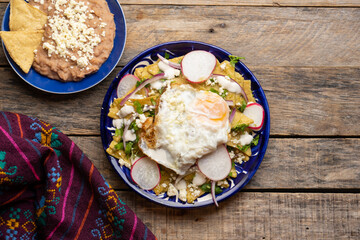 Mexican green chilaquiles with fried egg and cheese