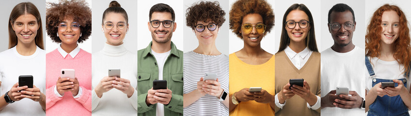 Young multiethnic group of people standing with phones in hands