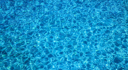 Close-up view of a transparent turquoise sea water that forms a natural texture in Malta
