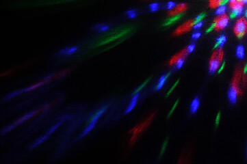 Obraz premium abstract colorful ray lights on dark background