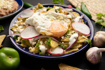 Mexican green chilaquiles with fried egg and cheese
