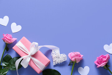 Composition with gift box, rose flowers and paper hearts on color background. Valentine's Day celebration