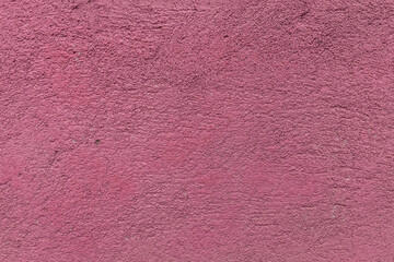 Fototapeta premium Rough painted pink stone wall surface texture background