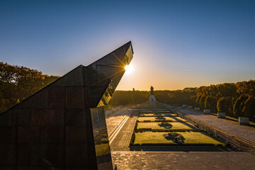 sunset over soviet war monument in berlin