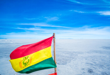 National flag of Bolivia on Uyuni sal lake, Bolivia