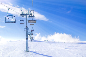 Ski lift and mountain landscape in winter, generic ski resort, high altitude