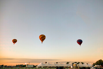 View of Many Hot Air Balloons Getting Ready to Take Off On An Early Morning Balloon Festival