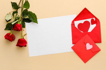 Composition with blank card, envelopes and rose flowers on color background. Valentine's Day celebration