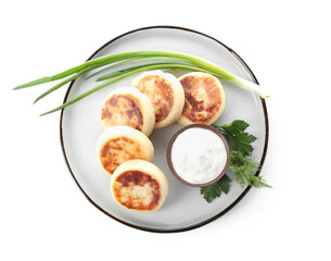 Plate with tasty cottage cheese pancakes and sauce on white background