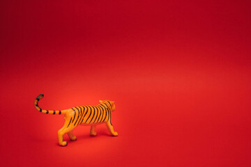 Fototapeta na wymiar Tiger in a box.Chinese new year 2022 on red background. Copy space.