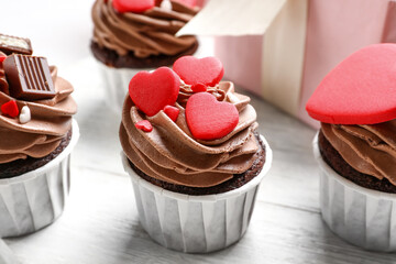 Tasty chocolate cupcakes for Valentine's Day on table