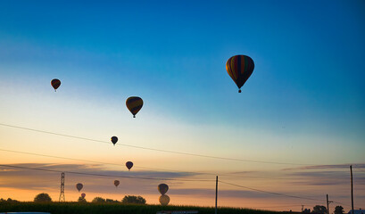 View of Many Hot Air Balloons Getting Ready to Take Off On An Early Morning Balloon Festival