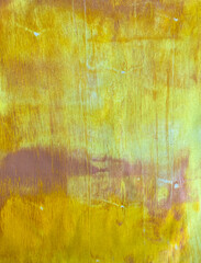 Yellow painted wall background with scratches and streaks