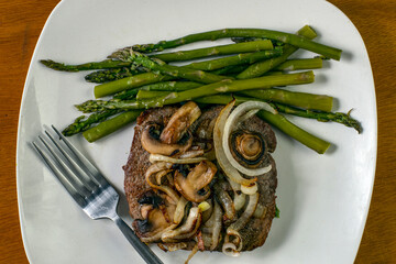 steak top with sauteed onions and mushrooms