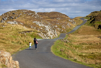 Mother and daughter walk through the beautiful, expansive surroundings of Slieve League in county donegal