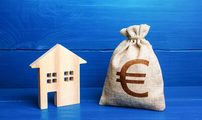 Figurine silhouette house and euro money bag. Buying and selling real estate. Taxes. Mortgage loan....