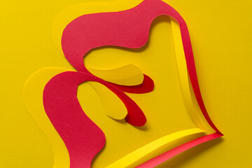 fancy cut paper shapes in yellow and red