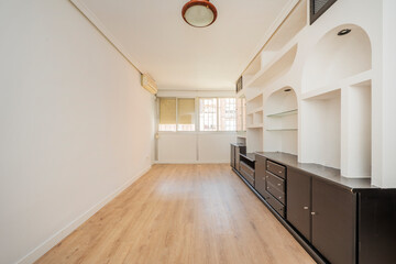 Living room with plaster bookcase over black wooden furniture © Toyakisfoto.photos