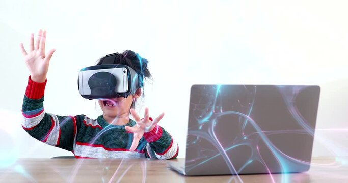 The little girl wearing VR sitting at desk in the home glasses virtual Global Internet connection metaverse. Future kids in white clothing wearing VR headsets for a game. concept advanced technology. 