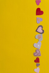 fancy cardboard hearts on yellow paper with blank space
