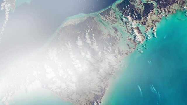 Flying over Bahamas island, aerial satellite view from space animation, based on image by Nasa
