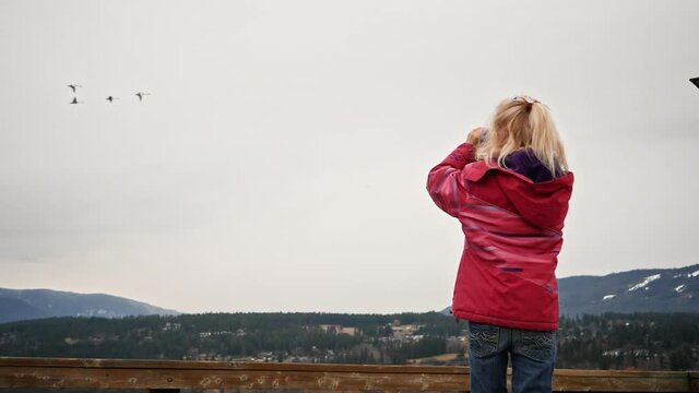 young girl bird watching photography in Canada