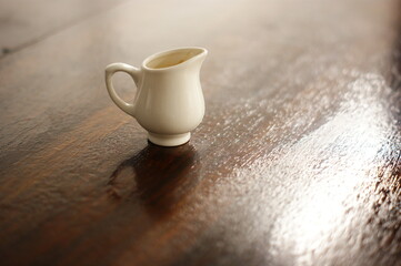 Porcelain cup used for pouring sauce, etc.