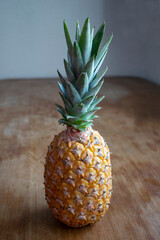 A health pineapple with wood background
