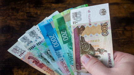 Bunch of Russian rubles are counted in the male hand