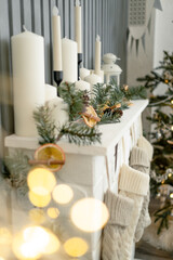 Christmas Home Decor with Fir branches, Christmas Tree and Candles. Soft focus