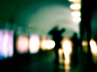 Fototapeta na wymiar Blurry image of human silhouette in a subway. 