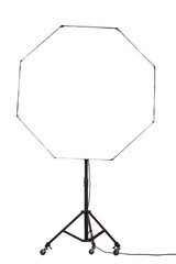 Flash light with octagonal octagon softbox on stand with wheels. Studio lighting equipment isolated on white background..