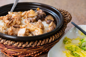 clay pot rice with chicken and mushrooms and cabbage