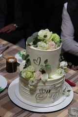 Cutting a wedding cake. Delicious dessert