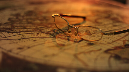 Close up of an old vintage map with magnifying lens